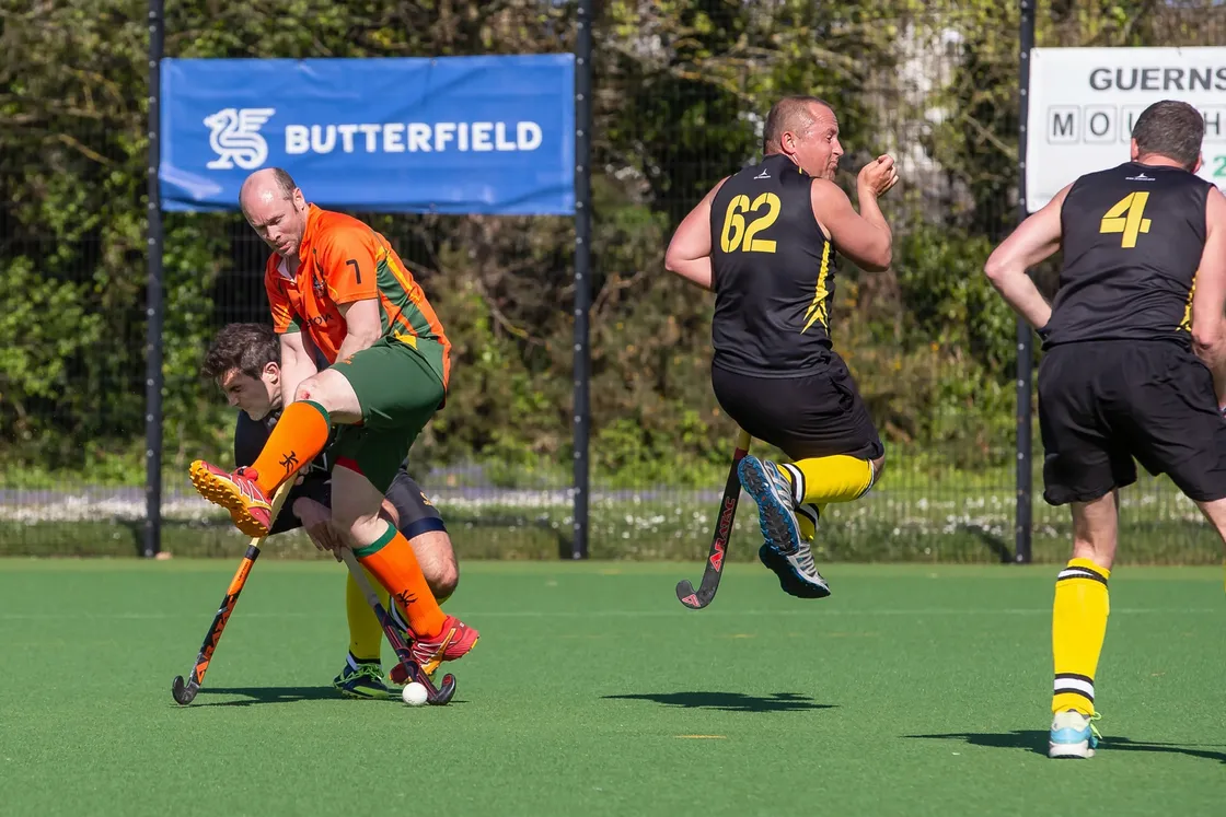 Steve Waldrom tries to get a shot away under pressure from Joffy Wilkes-Green. (Picture by Martin Gray, www.guernseysportphotography.com, 29528129)