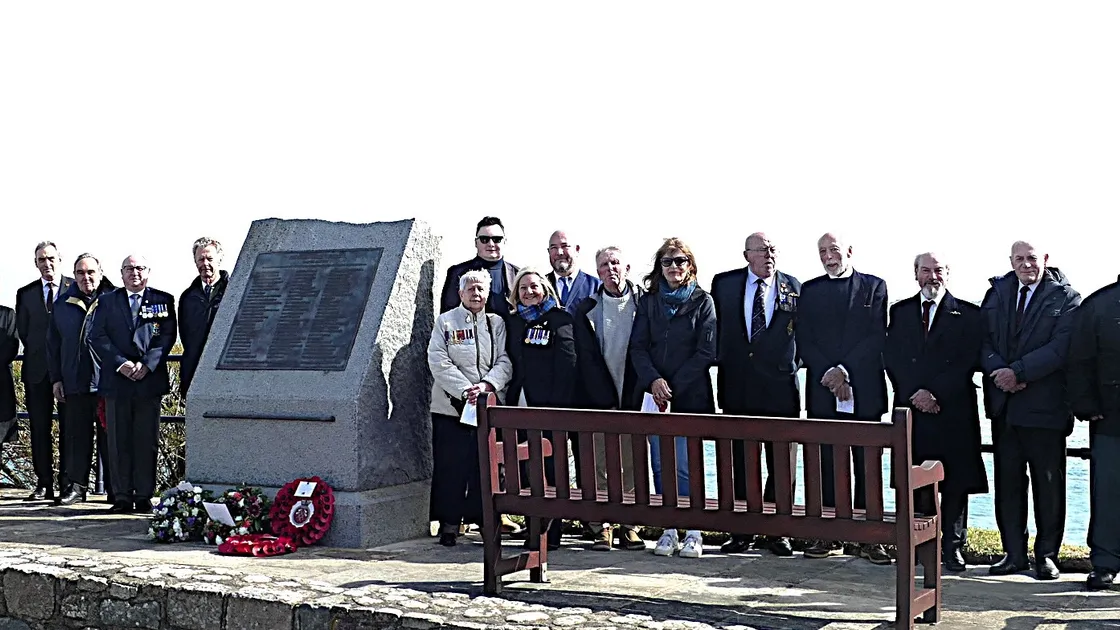 Submariners and families attending the memorial service at Braye Beach in Alderney to mark the 75th anniversary of the loss of HMS Affray. 			 (Picture by David Nash)