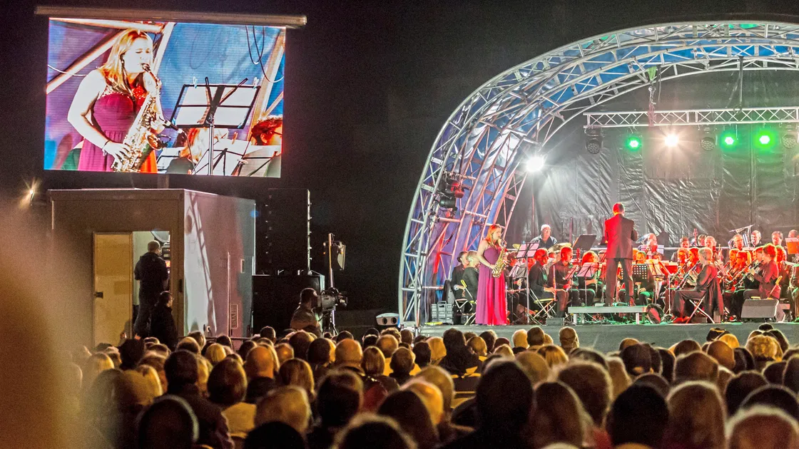 Alan’s daughter Katie Gough – herself now a music teacher – playing saxophone with GSW at the 2016 Proms On The Bay event