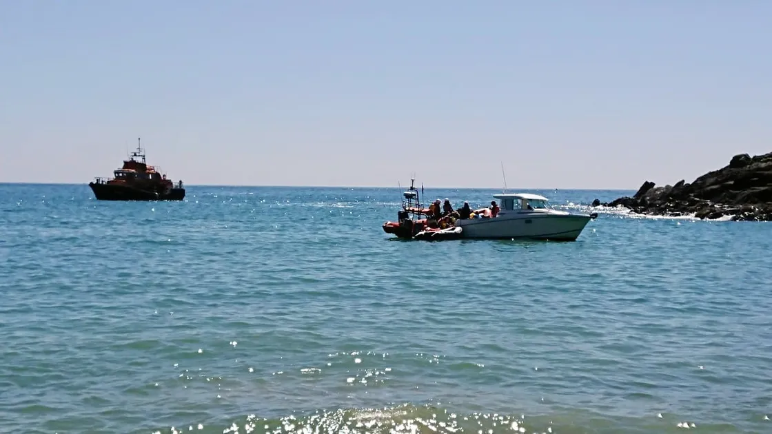 The Spirit of Guernsey stands by as five kayakers who got into difficulties in Petit Bot on Saturday afternoon are helped by the crew of the inshore lifeboat. The incident also involved St John, police and coastguard. The swell was too big to land them on the beach so they were taken to St Peter Port on the Spirit. (Picture supplied by St John Emergency Ambulance)