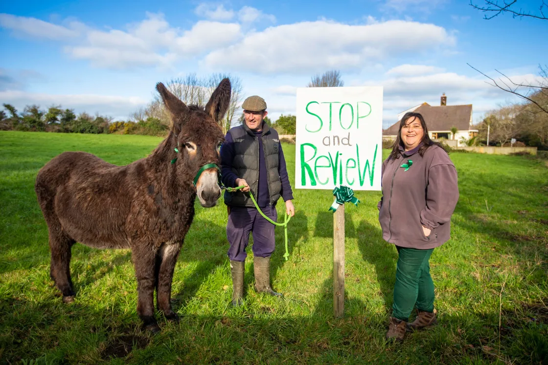 Nic and Nicky Jee with their donkey, Delilah. Their land backs directly onto the playing fields of Les Beaucamps School as it is already. (Picture by Sophie Rabey, 26961009)
