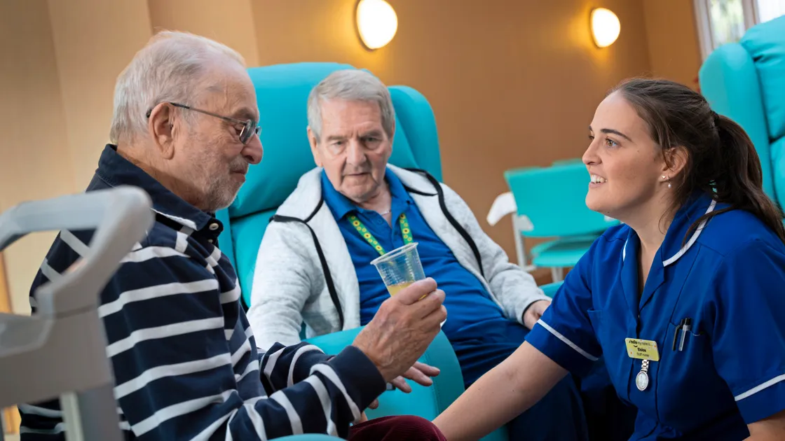 Staff nurse Eloise Tanguy speaks with Rodney Clough, one of the Les Bourgs wellbeing service’s ‘Thursday Friends’