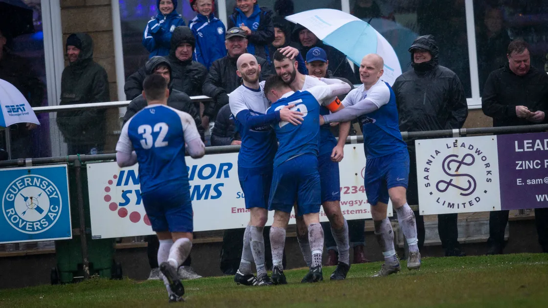 Blair Howitt is congratulated on his goal by his Rovers teammates on Tuesday evening at a wet and windy Port Soif. (Picture by Luke Le Prevost, 31998500)