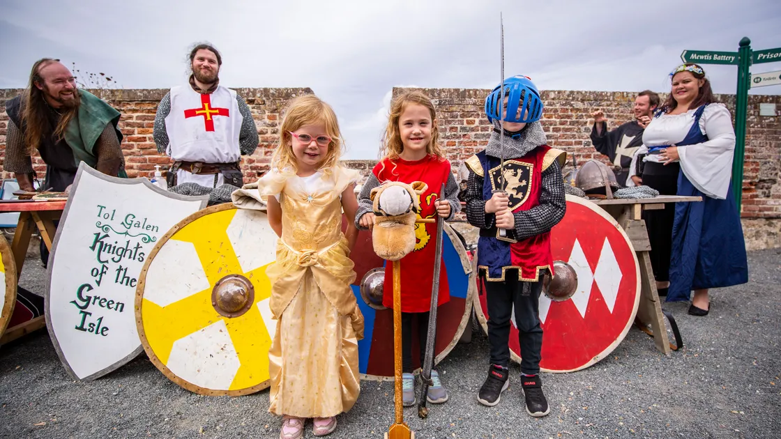 The Fete d’Etai Medieval Day at Castle Cornet. Left to right, twins Charlotte and Emma Low, 5, with their brother Harry, 6, all of whom were very excited to get dressed up and visit the castle. (Pictures by Sophie Rabey, 31171828)