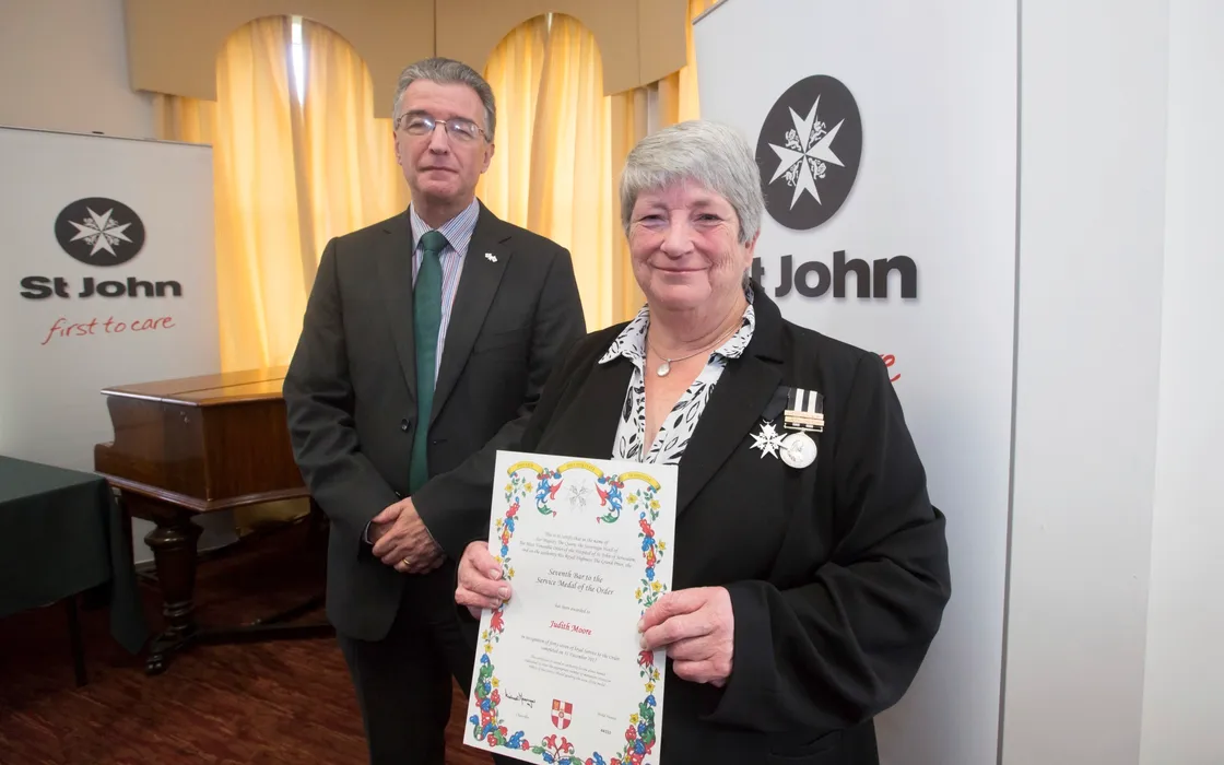  Bailiff Richard McMahon with Judith Moore who was awarded Seventh bar to the service medal of the order. (28936955)