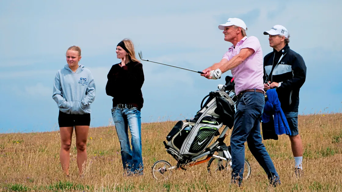 Daniel Griggs watched by, left to right, daughters Charlotte and Emily as well as caddie Gavin Rihoy. (Picture by Gareth Le Prevost, 33438994)