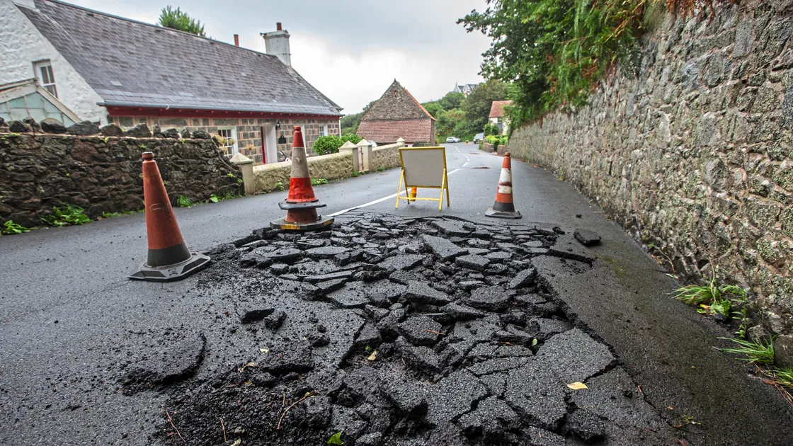 Damage to the road at Pleinmont Hill caused by flooding in the early hours of Saturday morning. (Picture by Peter Frankland, 33539012)
