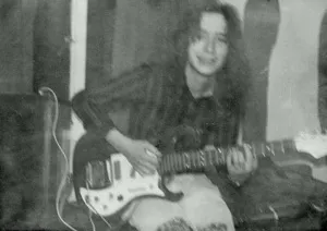 After his time in Guernsey, Parker moved back home to Surrey and then to Chichester. Playing guitar at the Boxgrove Youth Club in Sussex, Parker looked much as he did while in Guernsey, with long hair in the style of the time
