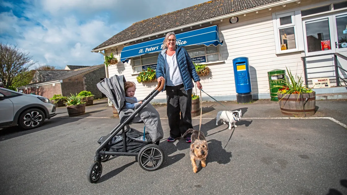 St Peter's resident Nancy Golland with her grandson Archer Walters, 10 months, and dogs Teddy and Harvey outside the post office. (Picture by Sophie Rabey, 33151834)