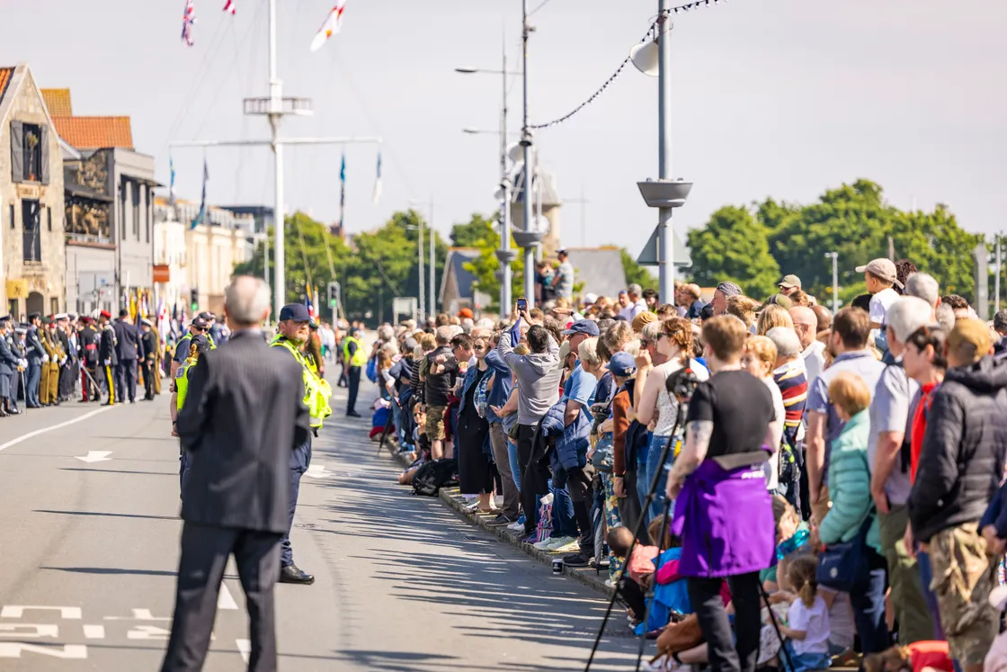 Each year the first event of Liberation Day brings a crowd, and morning sun welcomed rows of onlookers rather than the forecasted rain.