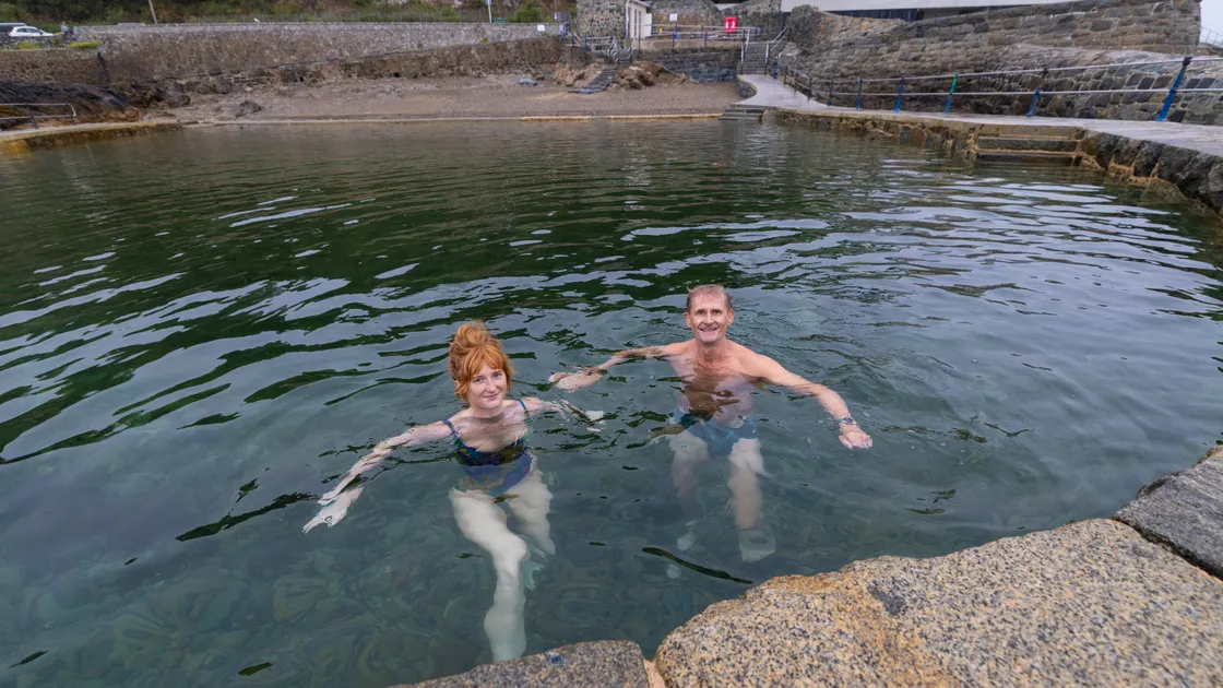 The Ladies’ pool at La Vallette is closed due to possible pollution. Swimmers Emma Avery and Rev Howard Davenport were using the childrens’ pool instead this morning. 											 (Picture by Peter Frankland, 34912786) 