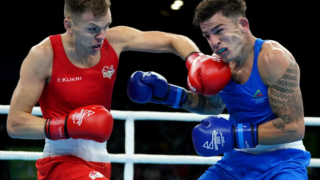 England's Lewis Richardson (left) lands a left on the chin of Billy Le Poullain during their middleweight quarter-final at the NEC. (Picture by PA, 31109879)