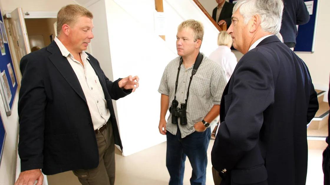 Lihou House was officially opened by then bailiff Geoffrey Rowland (right), here listening to Richard, along with La Societe Guernesiaise conservation officer Jamie Hooper