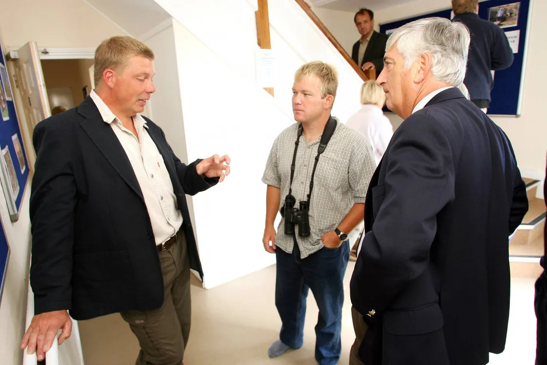 Lihou House was officially opened by then bailiff Geoffrey Rowland (right), here listening to Richard, along with La Societe Guernesiaise conservation officer Jamie Hooper