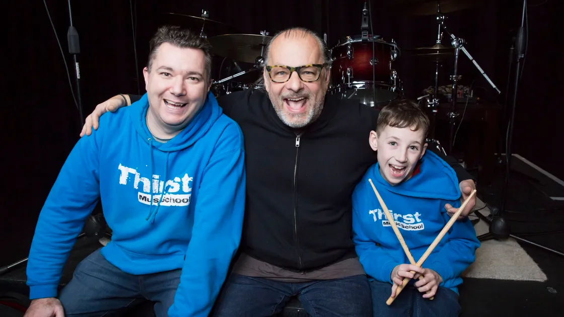 Ralph Salmins with Thirst Music School's Wayne Mahy and his son Calum, 8.(26925072)