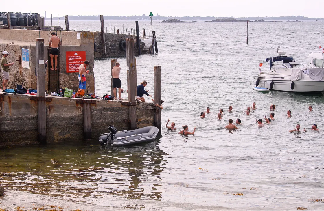 Runners cooled off at Herm harbour after a very hot and busy week of racing.