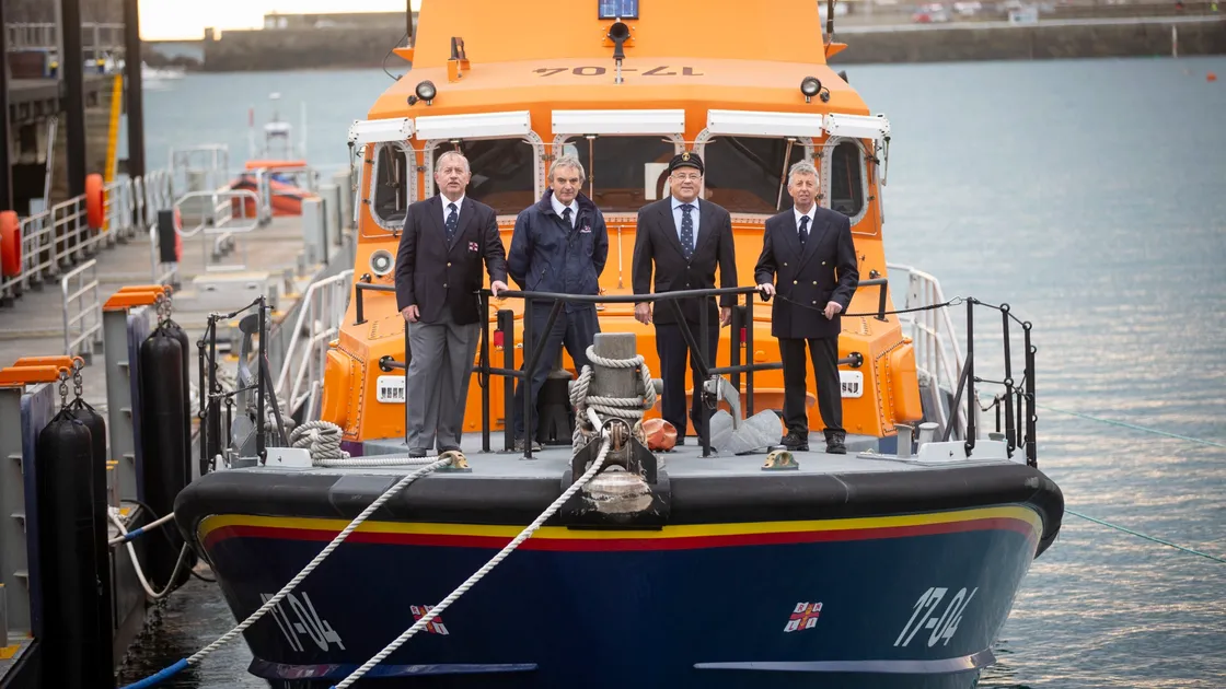 Former lifeboat crew members who were involved in the Bonita rescue on the current Guernsey lifeboat in St Peter Port. Left to right: Richard Hamon, John Webster, John Bougourd and Alan Martel. (Picture By Peter Frankland, 30237385)