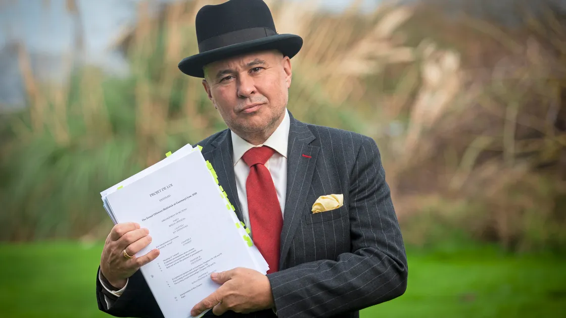 Carl Meerveld holding the Sexual Offences (Bailiwick of Guernsey) law 2020. He is concerned the proposal is a step too far and undermines the legal principal of innocent until proven guilty. (Picture By Peter Frankland, 30481178)
