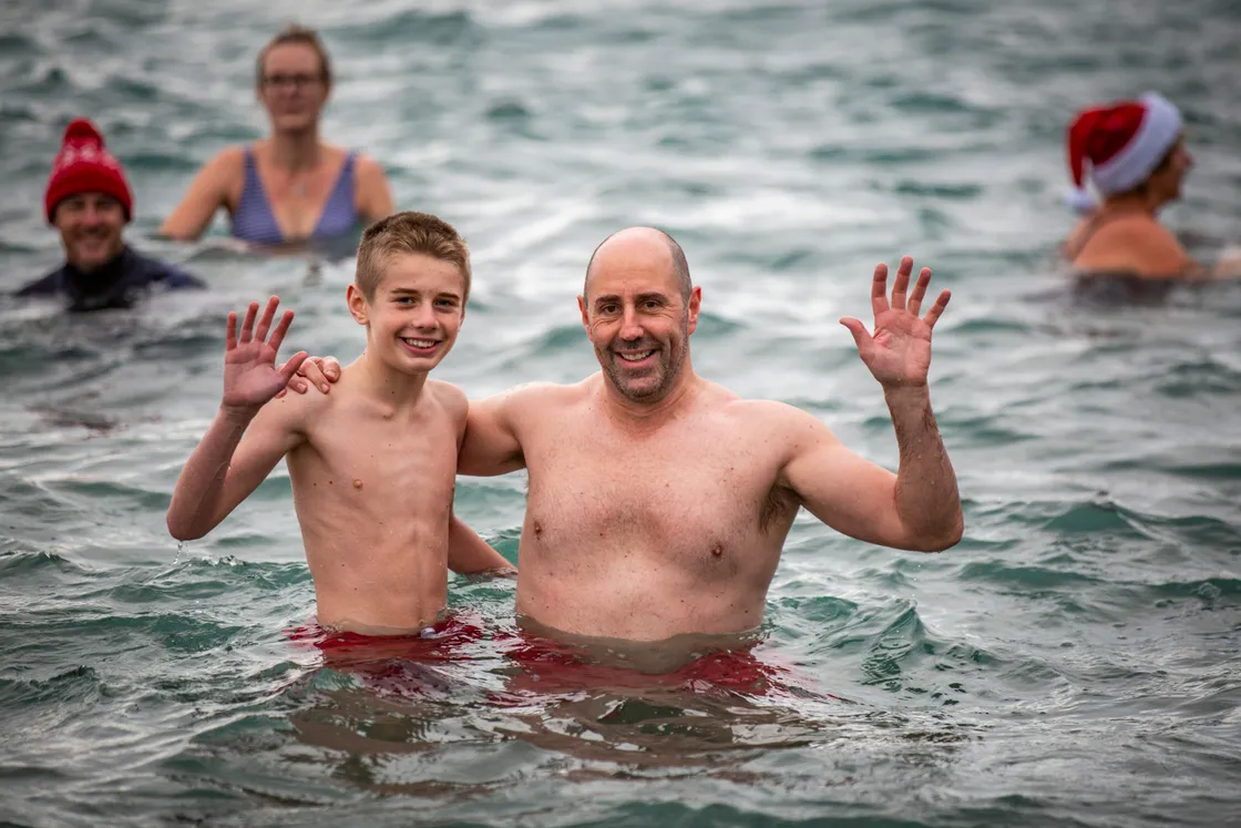 Mark Domaille, right, did the Polar Bear Swim for the first time since 2014, accompanied by his partner’s son, Ruari Perchard, 12. (31607872)
