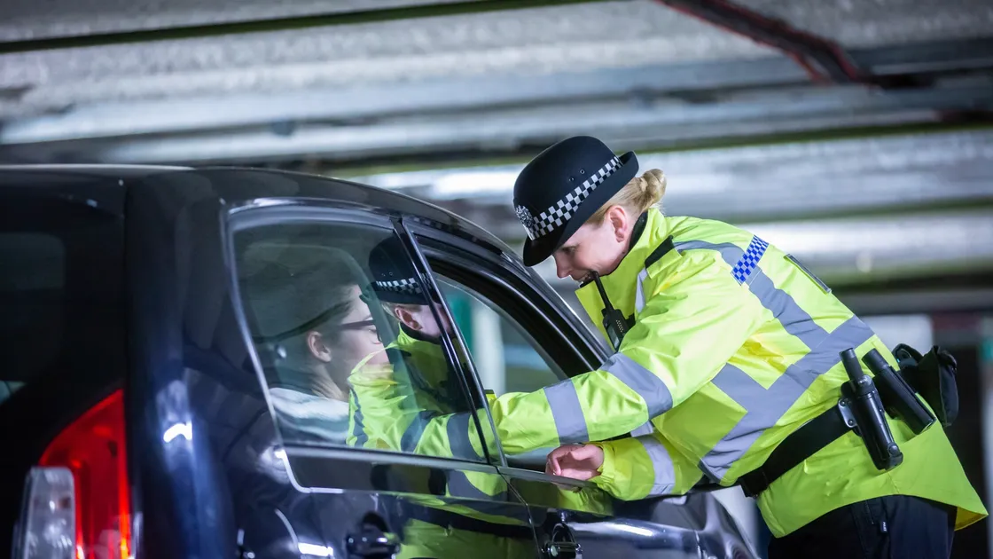 Student officer Jeanine Taylor pulls over Guernsey Press reporter Emily Hubert in a drink-drive test training exercise. (Picture by Peter Frankland, 29026671)