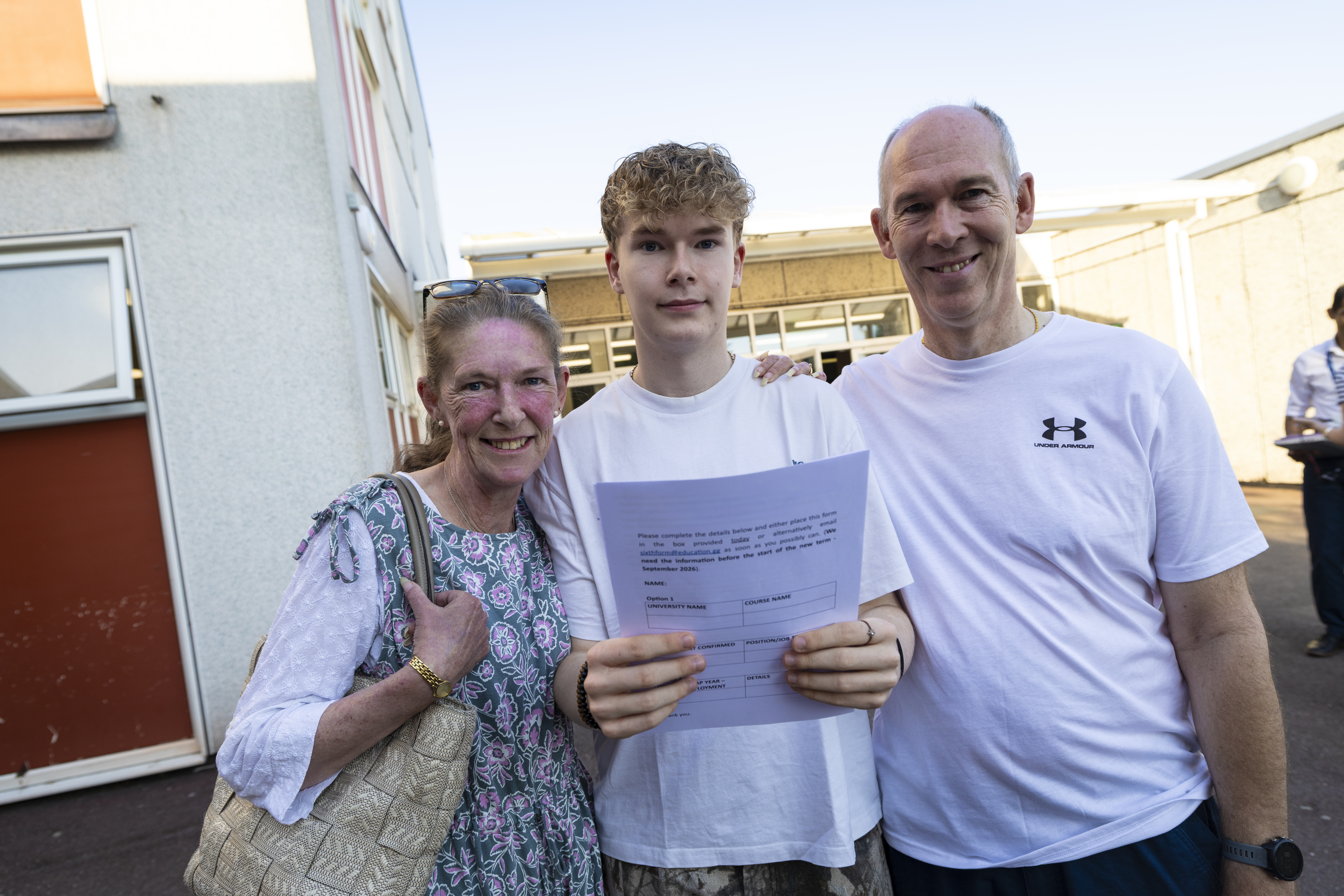 Students celebrating on results day with States pass rate up