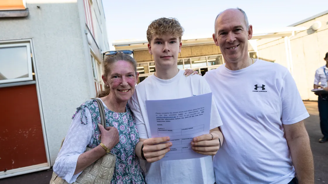 A-level results day at The Guernsey Sixth Form Centre. Alderney student Matthew Burke, 18, with his parents Angela and Jason.