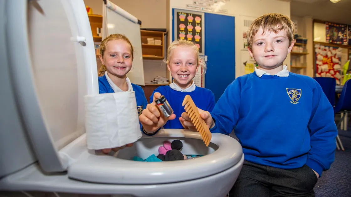Guernsey Water put on a special lesson at La Houguette School to teach pupils the importance of wastewater and what should and shouldn’t be put down a toilet. The centrepiece of the lesson was a fake toilet full of things that should/shouldn’t be put in it. The pupils pictured learning the rights and wrongs are, left to right, Maisie Johns and Indi Warren, both 9, and George Atkins, 10. (Pictures by Sophie Rabey, 28950975)