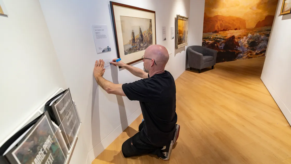 Stan Winstanley makes the final adjustments yesterday for the Lost in Nature exhibition opening at Guernsey Museum, Candie, set up in collaboration with the Health & Social Care arts and health programme.  (Picture by Sophie Rabey, 34724040)