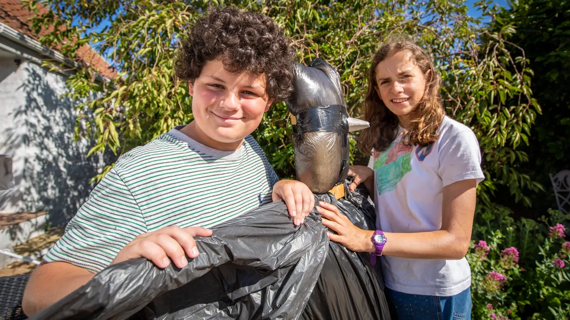 Ramsay Ismail, 12, and Christine Browning, 14, members of the Torteval Church Youth Choir, working on its scarecrow.(Picture by Sophie Rabey, 31050195)