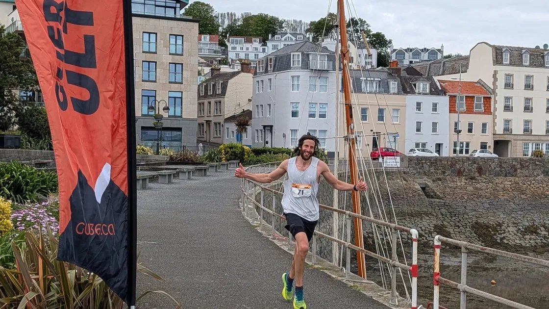 Rob Forbes crosses the finish line in first place.