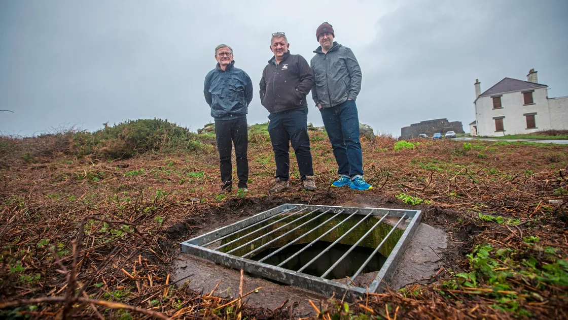 Left to right: Martin Joyce, Paul Bourgaize and Ben Drew of Festung Guernsey stand on top of one of the bunkers near Fort Doyle. (Picture by Peter Frankland, 32989639)