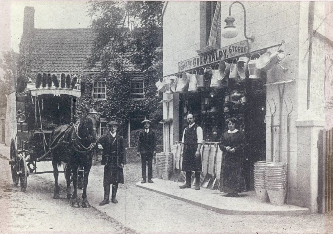 George Valpy and his wife outside their shop in Grande Rue, St Martin’s with the horse and carriage used for funeral services.