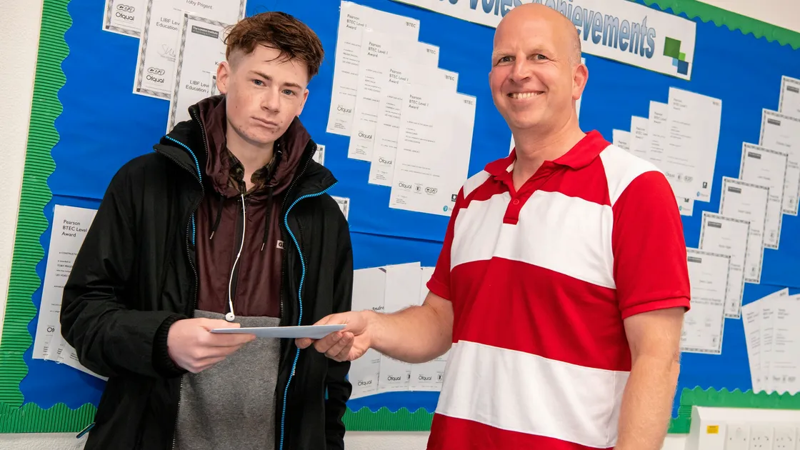 Les Voies student Toby Prigent collects his GCSE results from the school’s head teacher Jonathan Furley.
(Picture by Andrew Le Poidevin, 22345858)