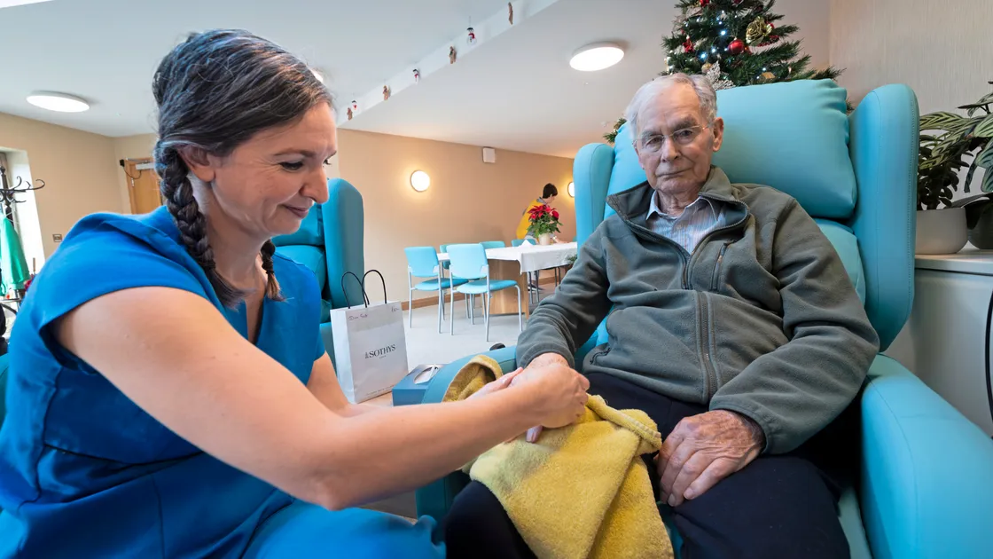 Luisa’s Beauty Salon owner Luisa Chiappa-Sarre, who volunteers at the centre, gives John Ozanne a hand massage