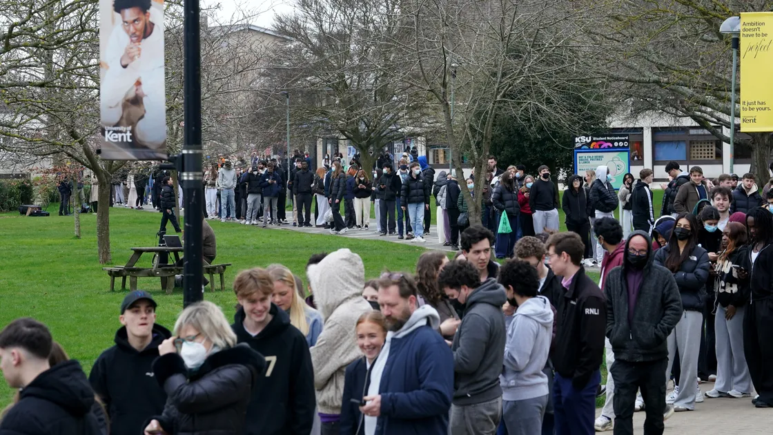 Students queuing for antibiotics outside a building at the University of Kent in Canterbury.