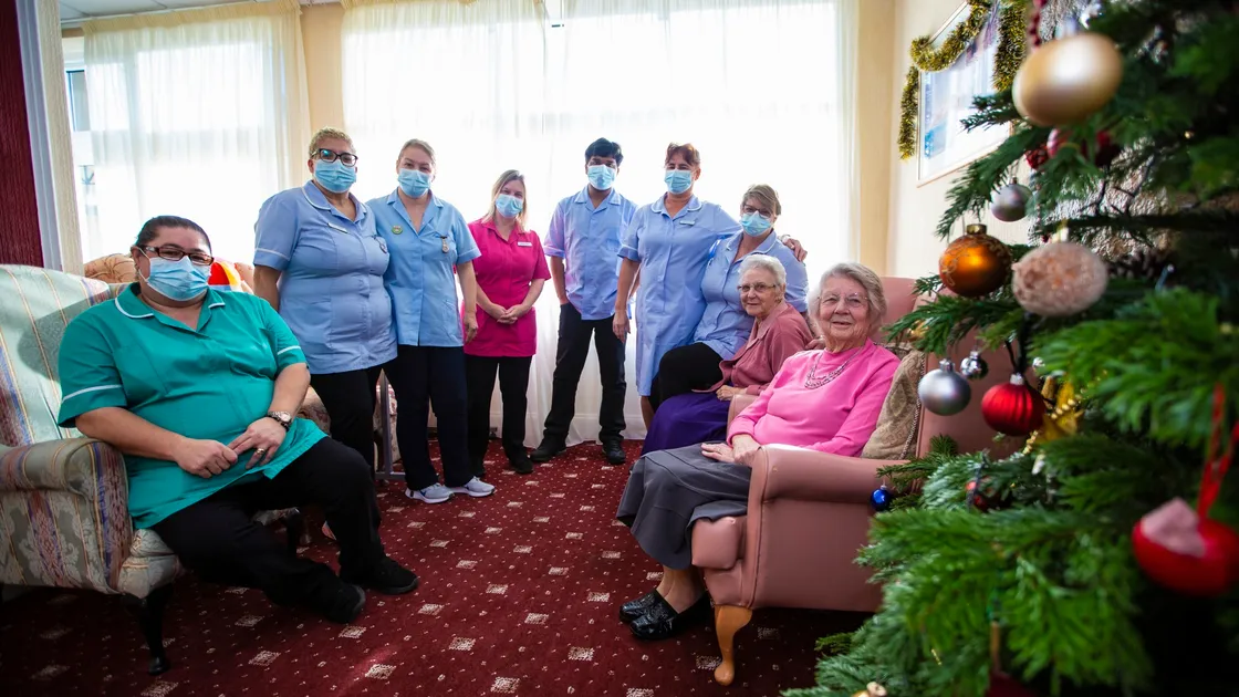 Summerland House Care Home staff who are working over the Christmas period. Left to right: Elsa Pereia, Betty Abreu, Elsa Dunne, Sarah Ross, Husain Ahmed, Matilda De Jesus and Lyndsey Nicholls with residents Margaret Norledge and Mona Falla. (Picture by Peter Frankland, 30322901)
