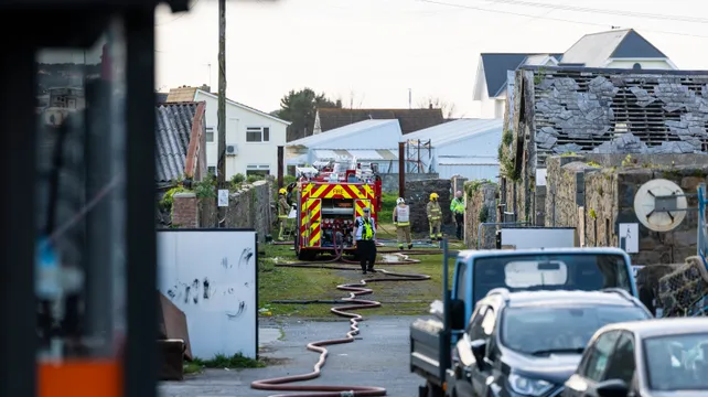 Two arrested after structure fire in Leale’s Yard