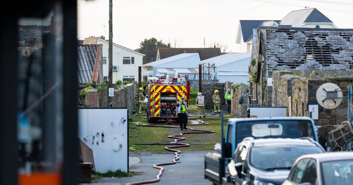 Two arrested after structure fire in Leale’s Yard