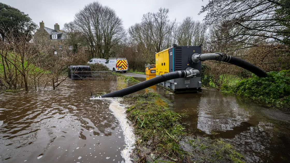 Heavy engineering takes on heavy rainfall as Guernsey Water tackles flooding in Rue de St Briocq, St Peter’s, yesterday. Although the utility felt it made some progress yesterday, by the end of the day the road was still closed. A blocked culvert is thought to be the cause