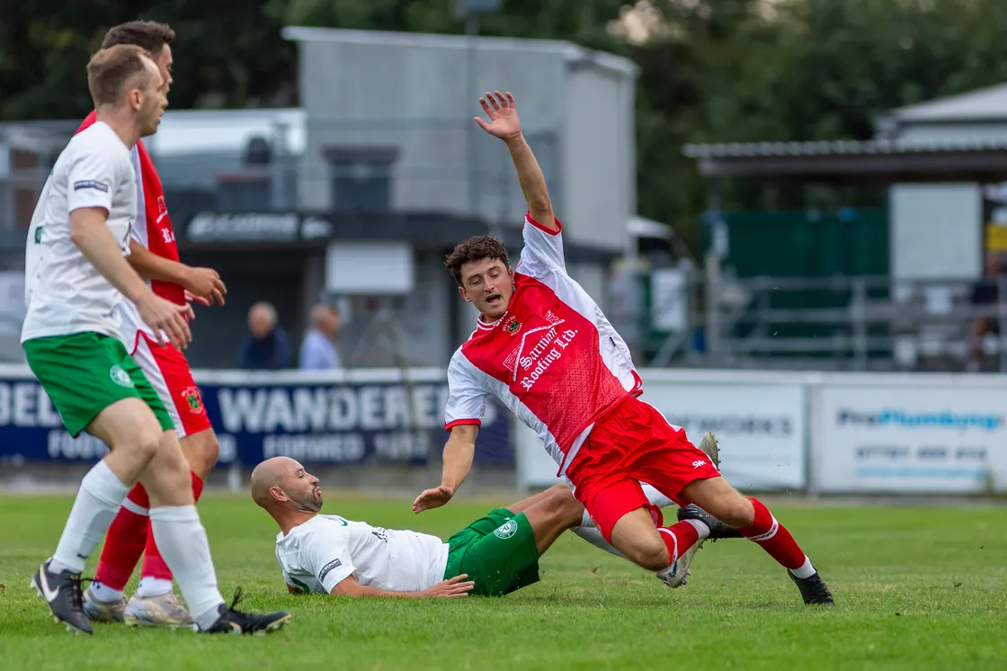 Vale Rec goalscorer Seb Skillen slides in on Oscar Leadbeater.