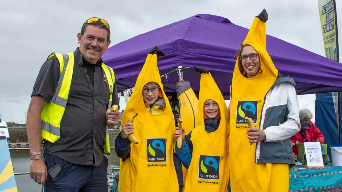 GSPCA manager Steve Byrne with Fairtrade Guernsey secretary Hannah Davis, right, and her two helpers, sons Henry and Edward Hodder, on the Fairtrade Guernsey stall.