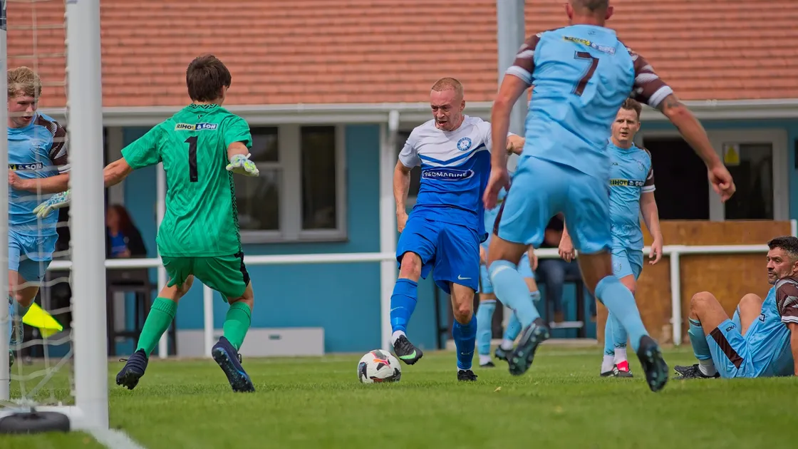 Tyler Crowther beats the North defence and pokes past goalkeeper Alex Le Cheminant for his second goal of the game.