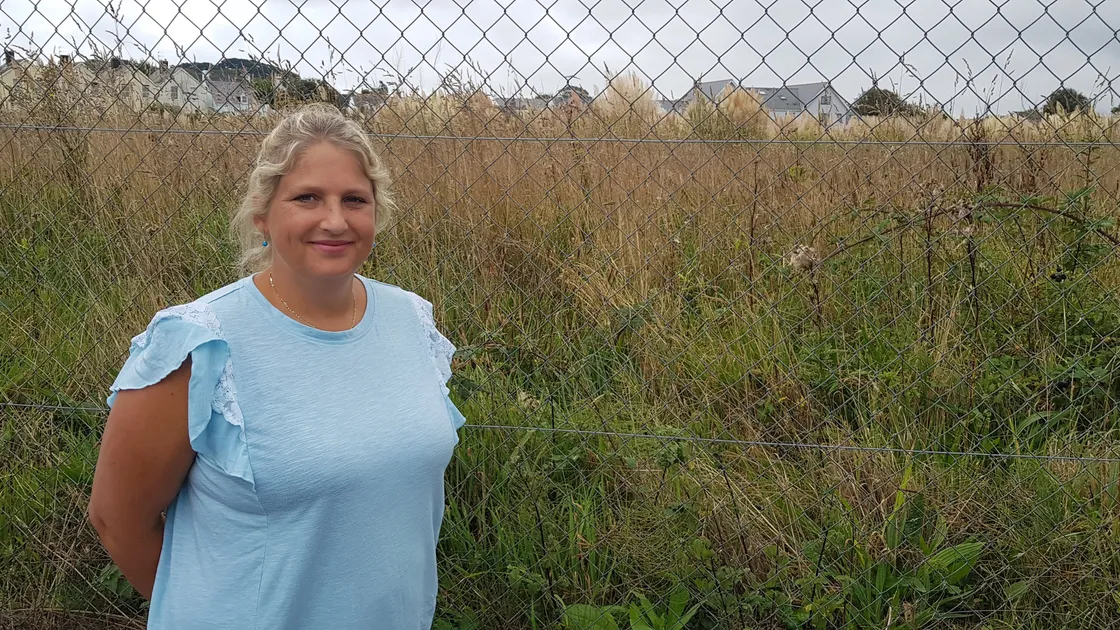 DPA president Victoria Oliver stood next to the boundary of the former Datapark site at Saltpans.The Guernsey Housing Association bought the site in 2022 for housing. But more sites need to be found to cope Guernsey's housing needs. (32522172)