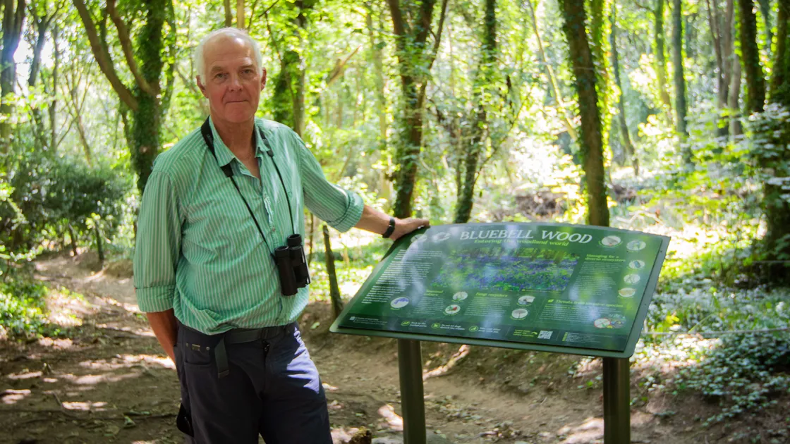 Francis Russell from Agriculture, Countryside & Land Management Services with that interpretation board that has been installed in Bluebell Woods. (Picture by Erin Vaudin, 34362802)