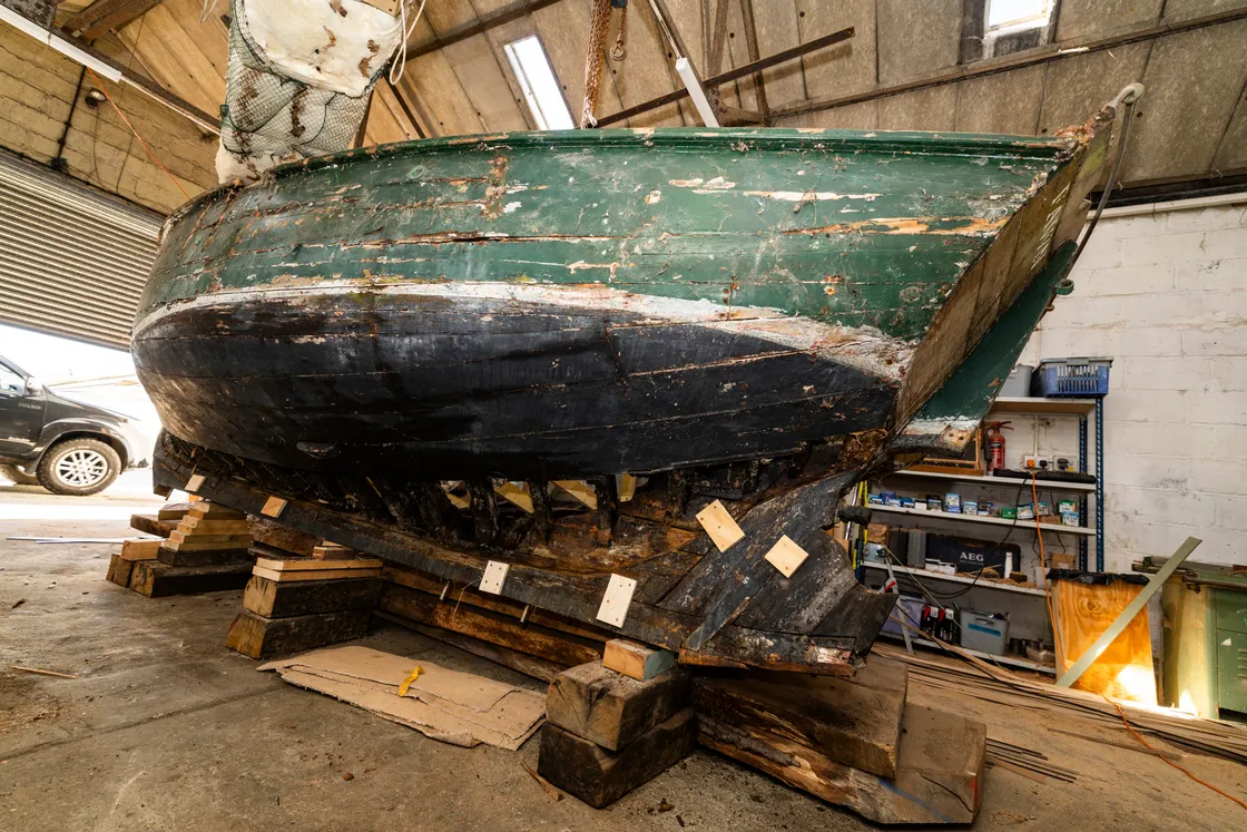 Fawn’s owner James Maguire had sailed the vessel for many years before a deteriorating keel forced him to take her out of the water. She remained in his garden for more than two decades until he found Edmund Morgan to repair it.