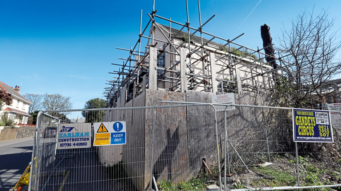 Guernsey Electricity has closed the pavement and adjacent parking area for public safety during the demolition of the houses along Vale Avenue.    (Picture by Steve Sarre, 21237454)