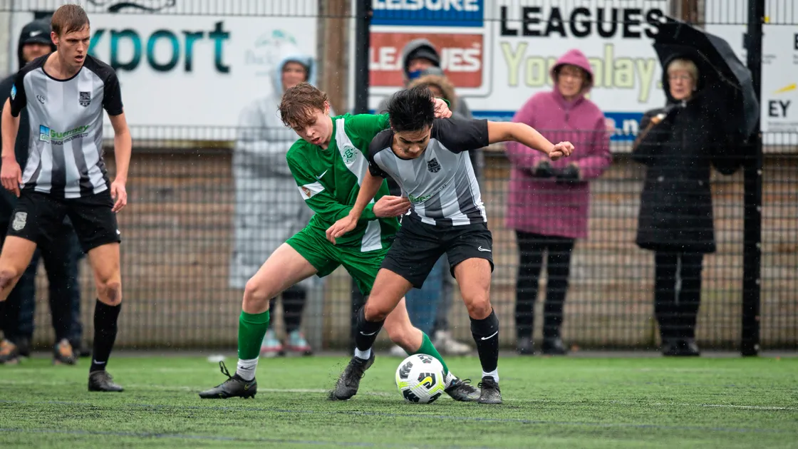 Finley Du Port gets to grips with club-mate Jake Lowe at the KGV. (Picture by Luke Le Prevost, 30495400)