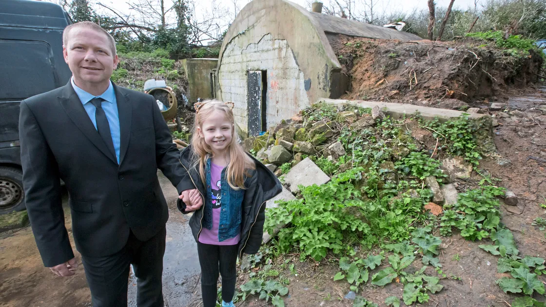 Steve Ogier, 45, pictured with his daughter Evelyn, wants to build a small eco-home home on land he owns in the Castel. The site has been used for dumping rubbish in the past and floods easily.                                                                (Picture by Steve Sarre, 21154664)