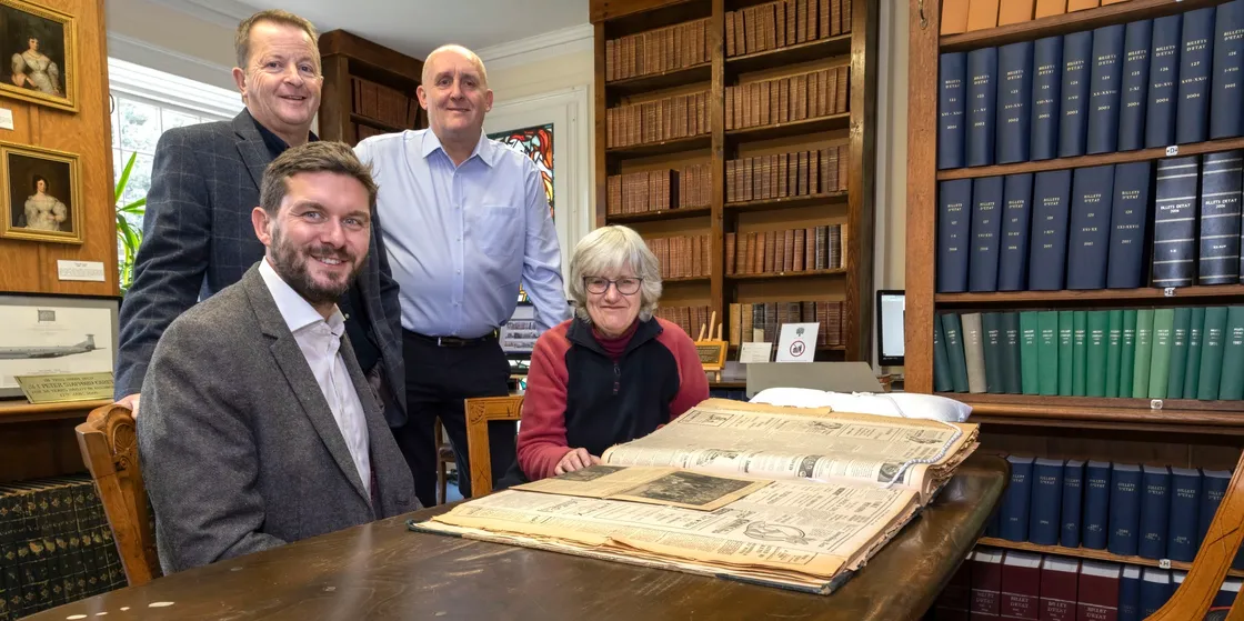 Phil Rowe, standing back left, was delighted that a picture of his late mum, Hazel, has been used on the new Sure telephone directory. Next to him is Trevor Burke, general manager of the Yello Media Group. In front are Mike Fawkner-Corbett, Sure’s head of consumer, and the Priaulx Library’s Sue Laker.