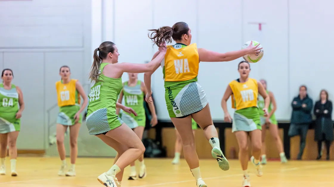 Bryony de Garis collects the ball marked by Nat Le Page